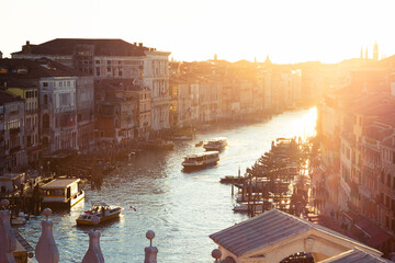 A charming sunset from the top of the Rialto Bridge, looking towards the Grand Canal in Venice,...