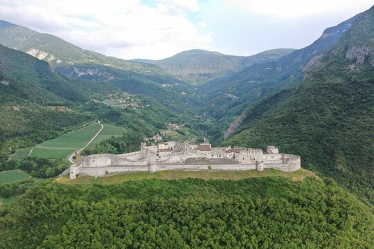 Aerial view of Beseno Castle, the largest fortified structure in Trentino-Alto Adige located in the municipality of Besenello, in the province of Trento. Besenello, Trento, Italy