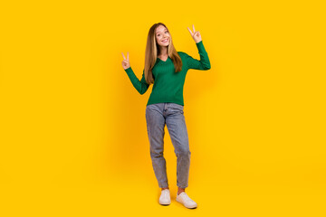 Full size portrait of lovely cheerful person hands fingers demonstrate hello greetings v-sign isolated on yellow color background