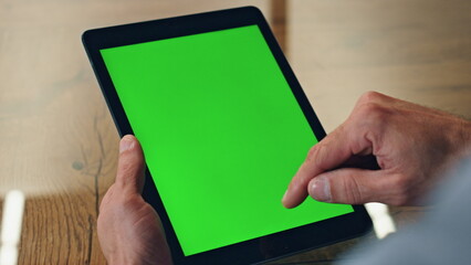 Boss finger swiping greenscreen tablet office. Director hands scrolling computer