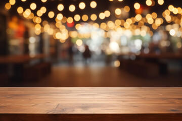 Empty wooden table outdoor street evening restaurant, blurred defocused background decorated with...