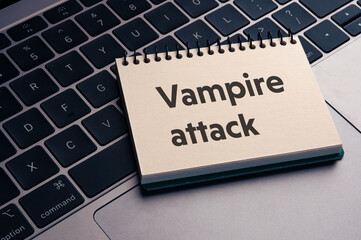 There is notebook with the word Vampire attack. It is as an eye-catching image.