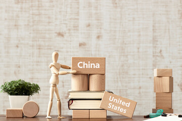 There is wood block with the word China or United States. It is as an eye-catching image.