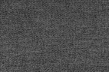 Fototapeta na wymiar Textile background, black coarse fabric texture, cloth structure close up, jacquard woven upholstery, furniture textile material, wallpaper, backdrop..