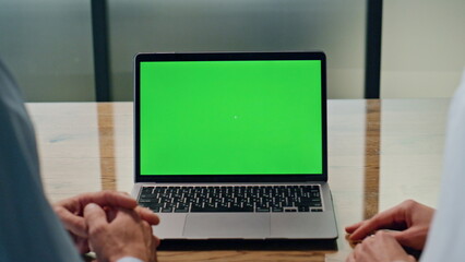 Business team using green screen laptop lobby closeup. Coworkers working online