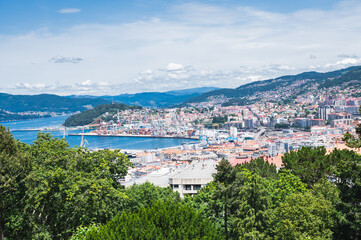 The view from the hill in Parque Monte del Castro, park located on a hill in Vigo, the biggest city in Galicia Region, in the North of Spain. View of the sea, houses and trees, selective focus