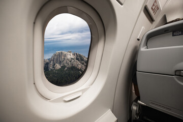 The four presidents at Mount Rushmore National Park in South Dakota through the window of an...