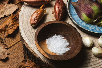 Raw organically grown artichoke flower buds on wooden table