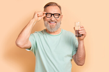 Photo of positive senior bearded man wear trendy clothes morning habit drink pills drugs health...