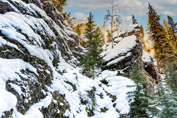 Golden light on snow covered mountain peak