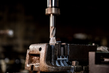 close up metal drill bit stay position for make holes in steel mold. Metal industry. milling...