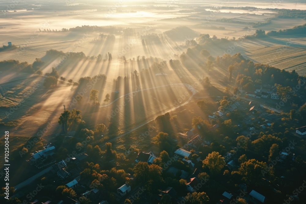 Sticker Sun shining through the clouds over a small town. Perfect for illustrating a peaceful and scenic environment