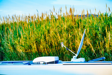 Caravan roof, satellite dish and air conditioner