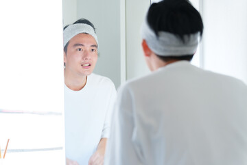 Obraz premium 洗顔をする男性 メンズビューティー コンセプト