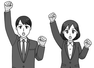 ガッツポーズのスーツの男女