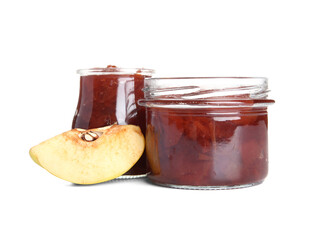 Jars of sweet jam with quince fruit slice on white background