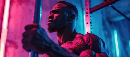 Muscular man powerlifting in neon-lit cross-training gym. - obrazy, fototapety, plakaty
