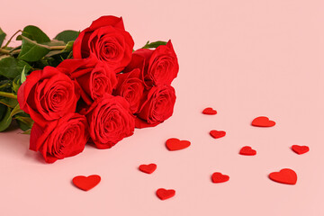 Red roses with hearts on pink background. Valentine's day concept