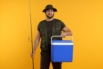 Fisherman with fishing rod and cool box on yellow background