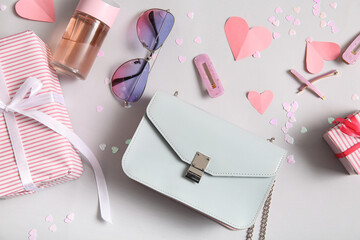 Composition with stylish female accessories and gifts for Valentine's Day celebration on light background