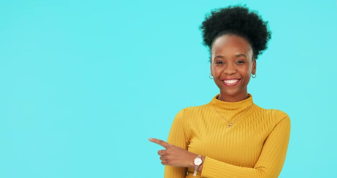 Face, black woman and pointing to mockup space in studio isolated on a blue background. Portrait, funny and person with hand for advertising, marketing or commercial promotion for branding and laugh