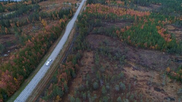 Caravan Camping driving on E45 Higway Road through the wilderness of middle Sweden near the town Lomsele