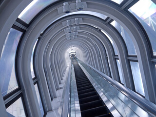 Going up on Long straight escalator in glass tunnel with steel arches, perspective view