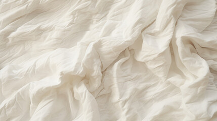 Close-up of crumpled white linen, an inviting and soft bedding texture backdrop.