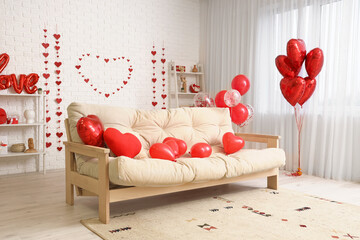 Interior of modern living room with comfortable sofa and decor for Valentine's day