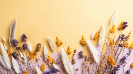 Rolgordijnen Assorted dried botanicals and lavender flowers artfully arranged on a pastel yellow background, evoking a warm, gentle mood. © tashechka