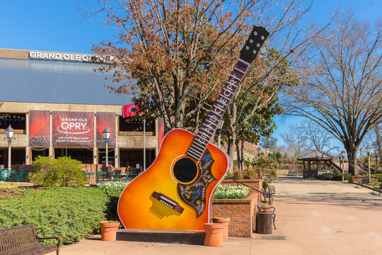 Nashville, TN, USA - February 27, 2018: The Grand Ole Opry is one of the most famous music venues since being created in 1925. The area around it is filled with guitars, a food truck and seating.