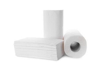 Rolls and stack of paper towels isolated on white