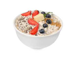 Tasty boiled oatmeal with berries, chia seeds and peanut butter in bowl isolated on white