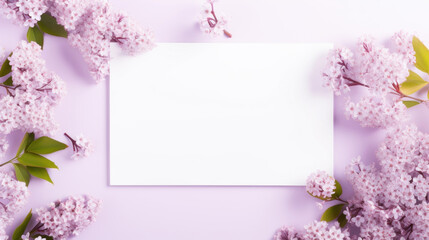 A white blank card surrounded by fragrant lilac flowers on a purple background, perfect for a heartfelt note.
