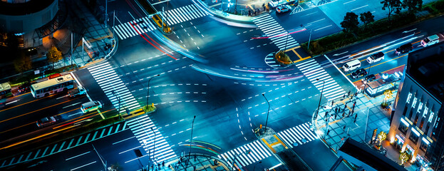 A busy intersection with traffic and people in Toyosu, Tokyo, Japan - obrazy, fototapety, plakaty