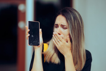 Sad Woman Crying for her Broken Expensive Smartphone Screen. Unhappy desperate girl damaging the...