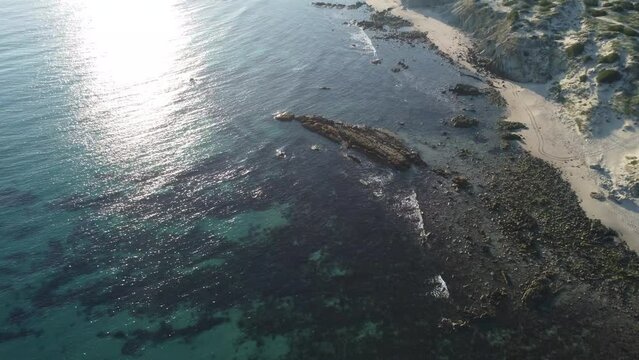 reef and beach frome above by drone, punta paloma in tarifa, spain