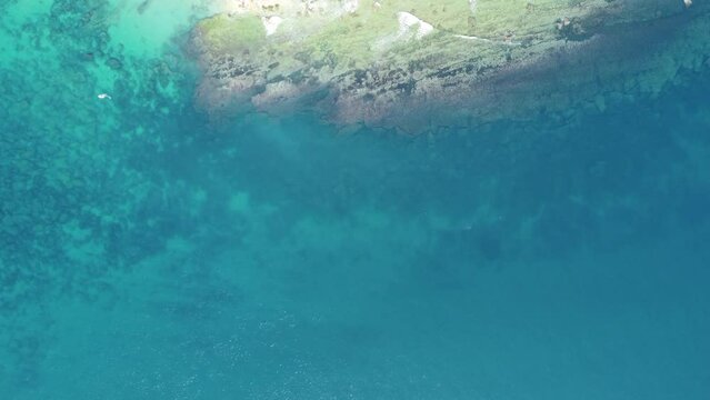 reef in front of the lighthouse in canos de meca, drone