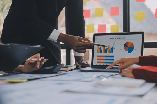 Finance manager meeting discussing company growth project success financial statistics, professional investor working start up project for strategy plan with document, laptop and digital tablet.