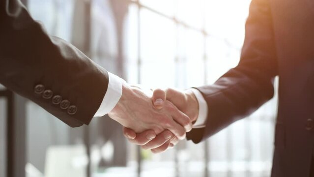 close up. handshake of business partners in the background of the office.
