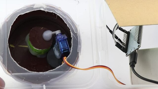 Micro servo of plastic geared type is used to perform the open and close mechanism on a lid as a part of some prototyping mechatronics project