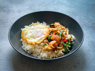 Rice topped with crispy pork belly with Thai basil and fried egg