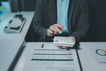 They are having a meeting about the company's income and expenses, team of analyst working on financial data analysis dashboard on paper as marketing indication for business strategic planning.