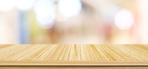 Wood table background and blur background, Empty wooden counter, shelf surface over blur bokeh...