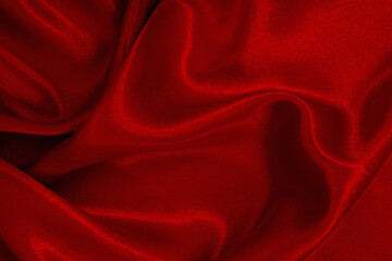 Dark red fabric texture background, detail of silk or linen pattern.