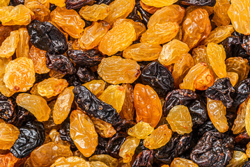 Sweet Yellow and Black Raisins Background