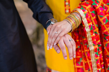 Indian couple's holding hands close up