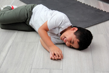 Obraz premium Latino child has a laughing attack due to Emotional Lability Involuntary and inappropriate laughter caused by a nervous system disorder