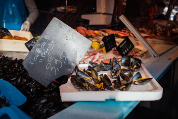 Seafood stand with mussels on a french market
