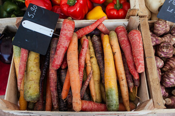 Rainbow carrots on a french market stand 